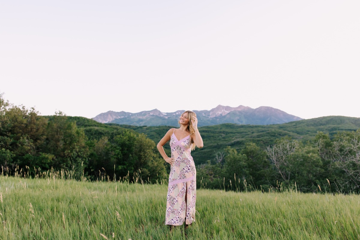 Harper standing in a mountain meadow