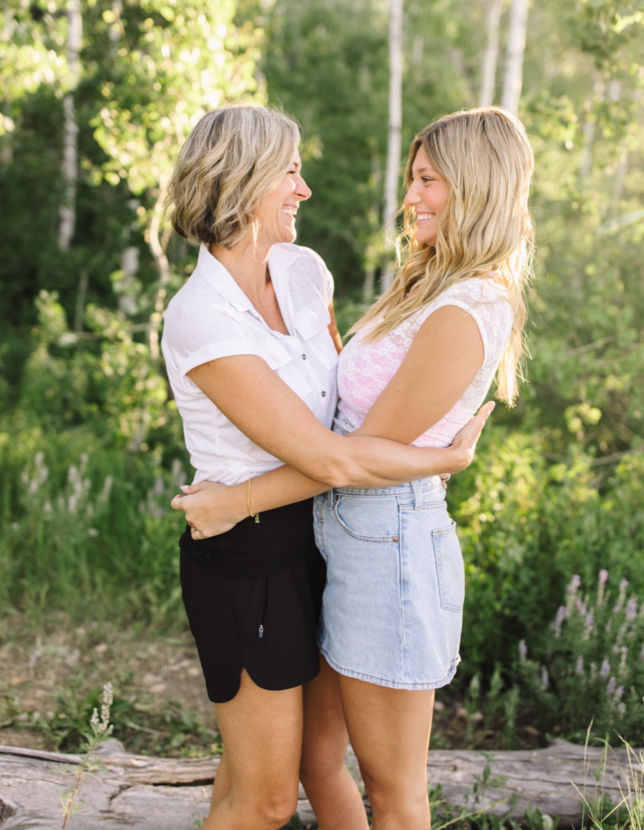 Niki and Harper hugging among the aspens